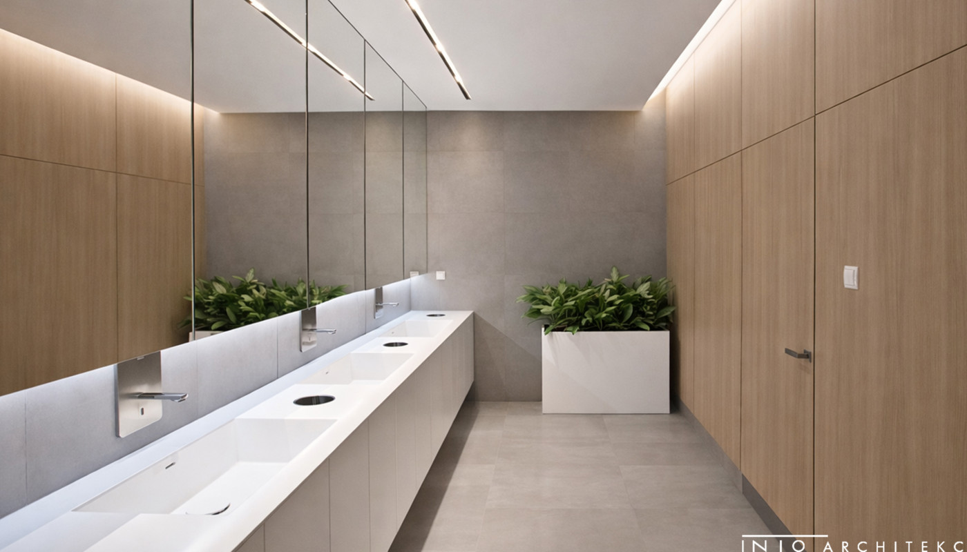 Projekt strefy sanitarnej w biurze w Poznaniu – minimalistyczne wnętrze